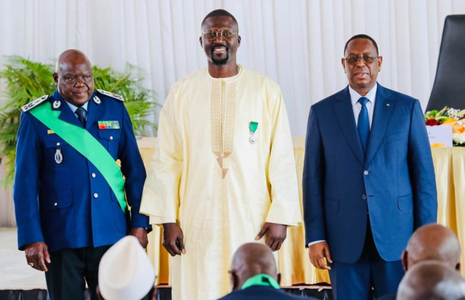 Moustapha DIeng, PCA du FDCUIC, co-fondateur de la Marmite du Coeur et PDG de Sen'Art Vision est élevé au grade de Chevalier de l'Ordre National du Lion. Moustapha DIeng, PCA du FDCUIC, co-fondateur de la Marmite du Coeur et PDG de Sen'Art Vision est élevé au grade de Chevalier de l'Ordre National du Lion.