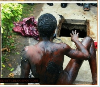 Photos choquantes: une présumée sorcière se change en un oiseau et reste coincée sous un drainage à Lagos ( Nigéria)